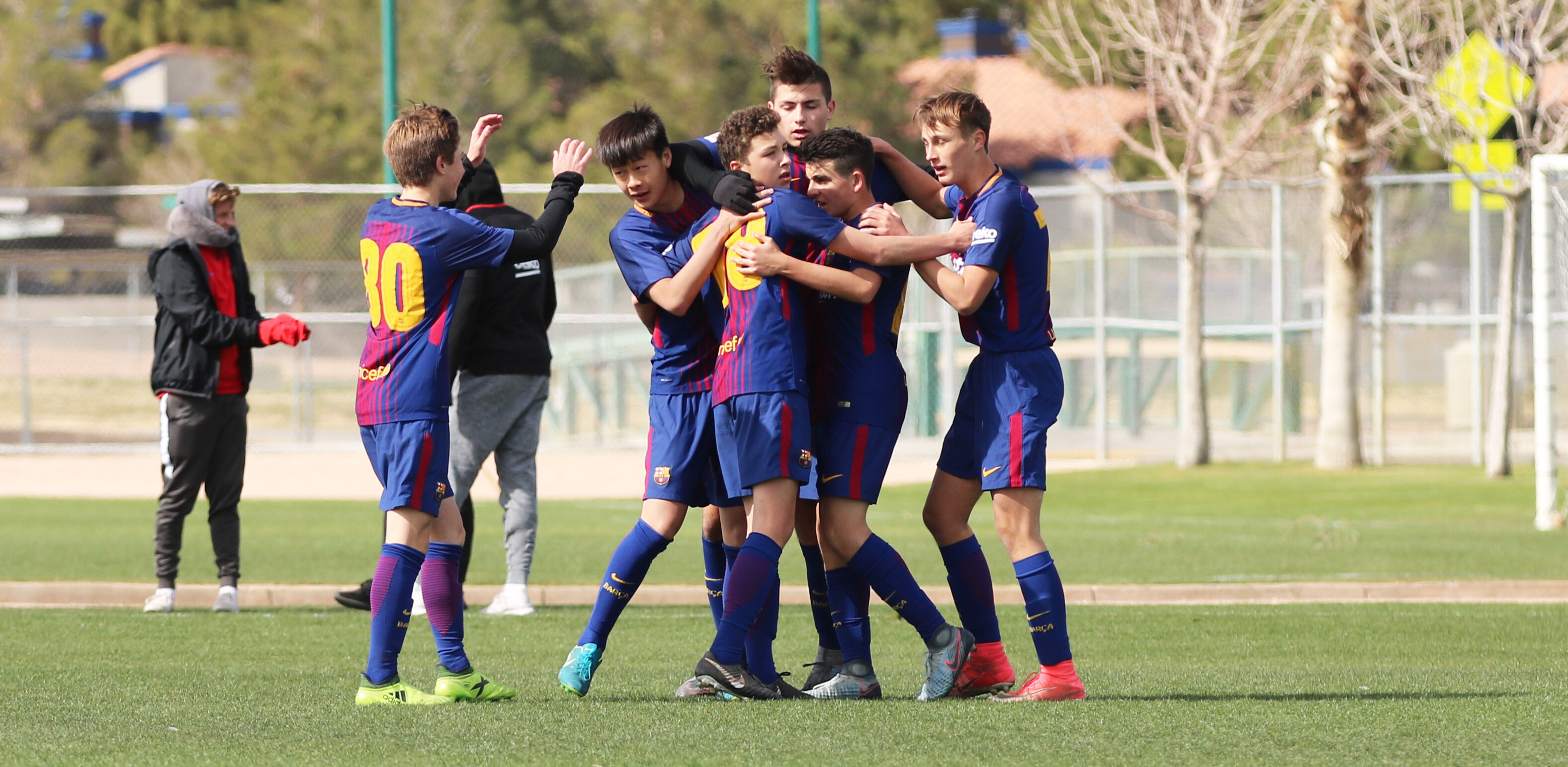 Barça Academy Players celebrate scored goal