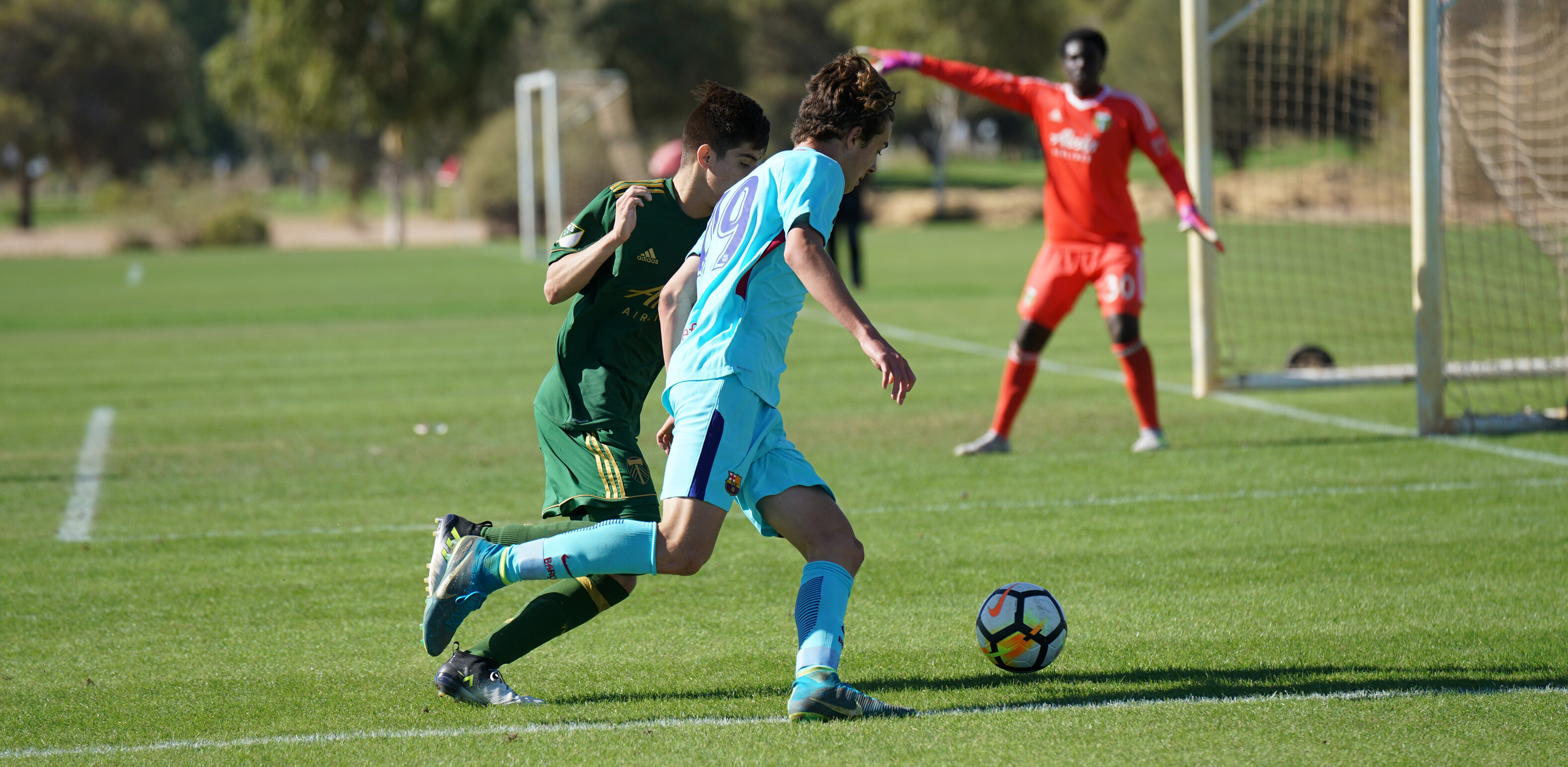 Barca Acadmey player, Austin Amer making a drive down the right line in an USSDA match