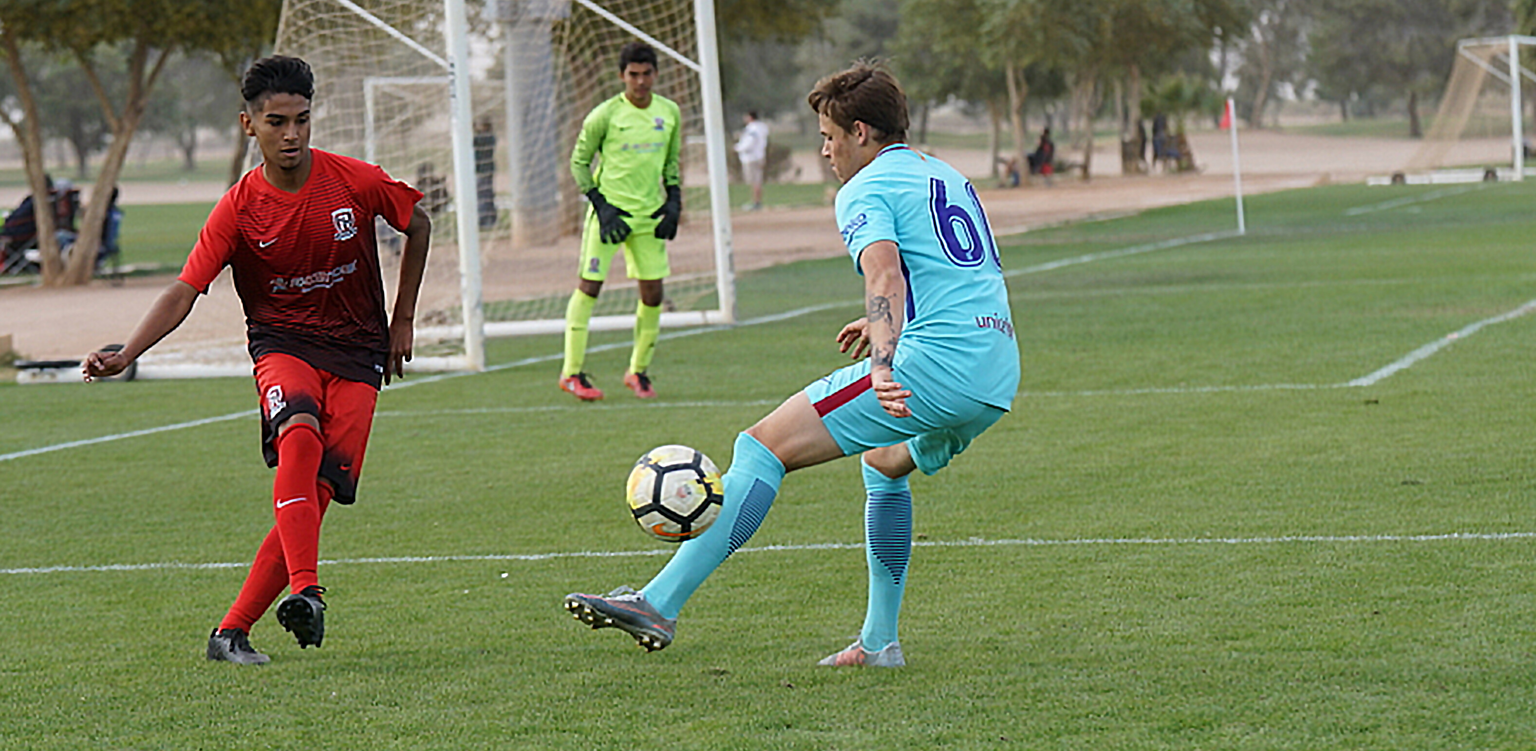 Barça Academy soccer player, Jake LaCava, attempts to bypass defender for a shot on goal.