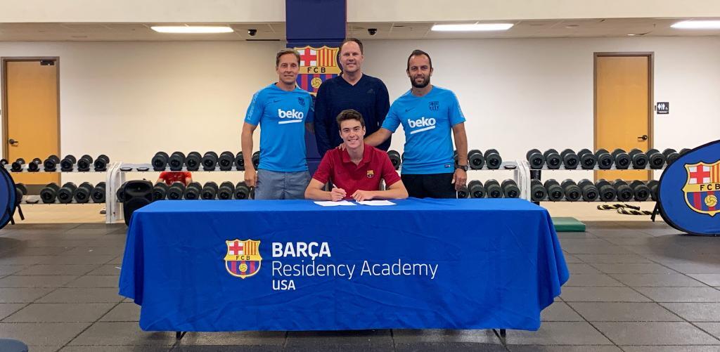 Barca Residency Academy's Matthew Hoppe signing his first professional contract with Matthew Hoppe. (left to right) Miha Kline, Tom Hoppe, Matthew Hoppe and Sean McCafferty.