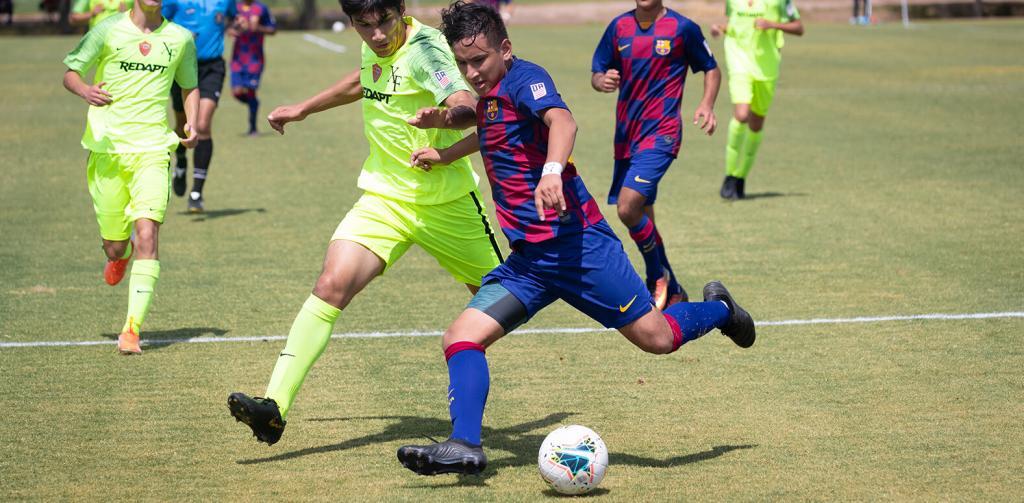 Barca Residency Academy player Edwin Arias taking beating a defender during a game