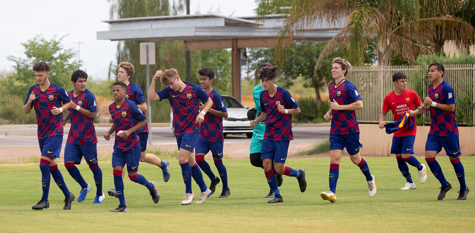 Barca Residency Academy U-17s running out the field at Grande Spots World