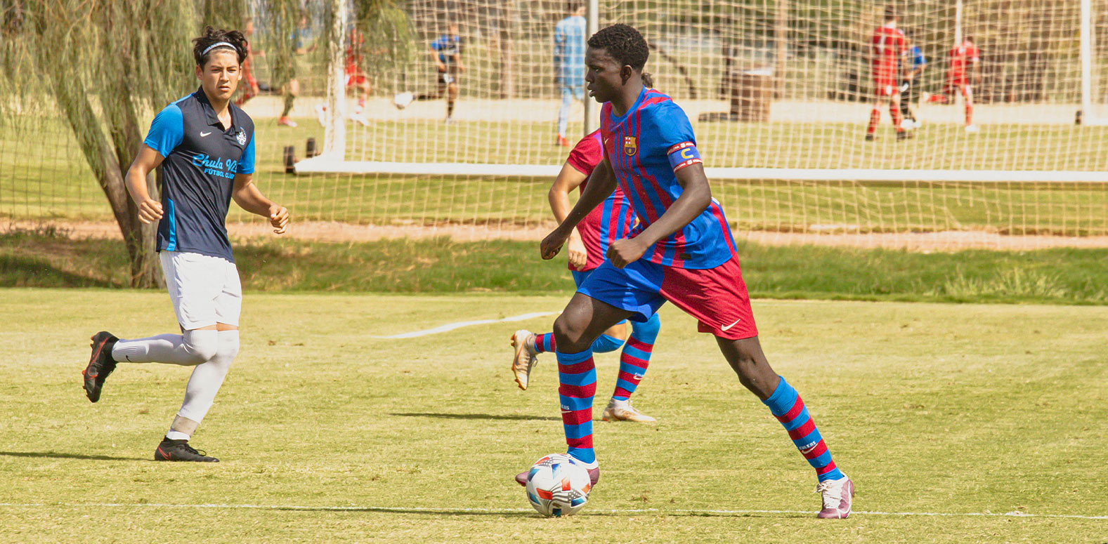 Barca Residency Academy player Korede Osundina driving the ball up the field vs. Chula Vista FC