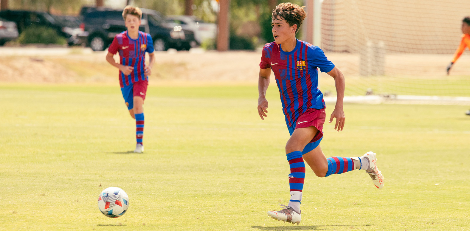 Barca Residency Academy U-15 player Sean Petrie driving the ball up the field