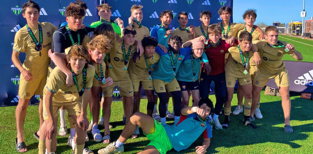 Barca Residency Academy U19 Elite Academy team celebrating after winning the Arizona Soccer Clash tournament at Legacy Sports Complex in Mesa, Arizona.